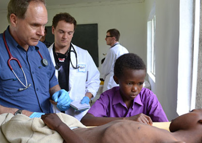 Dr Ray Comeau with a hatian child
